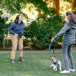 Dog trainer showing a client how to train their dog